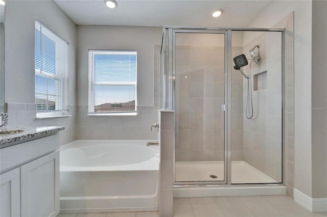 bathroom featuring vanity, separate shower and tub, and tile patterned flooring