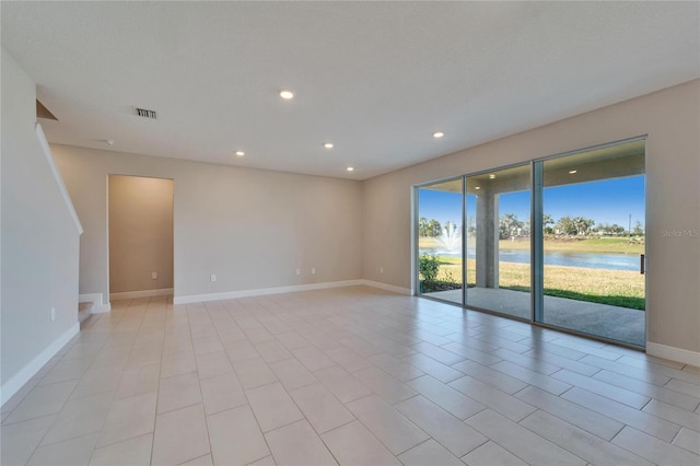 empty room featuring a water view