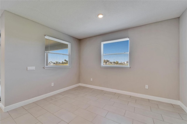 spare room featuring a textured ceiling