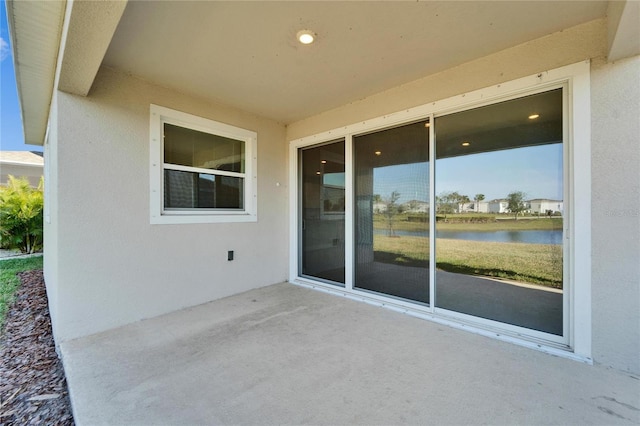 view of patio / terrace with a water view