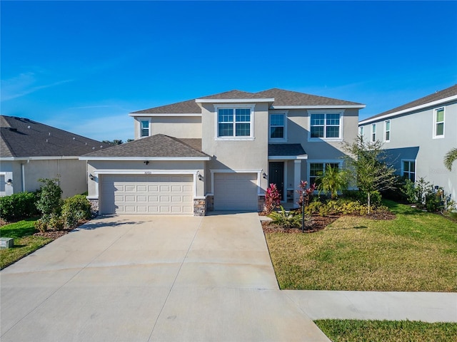 view of front facade featuring a garage and a front yard