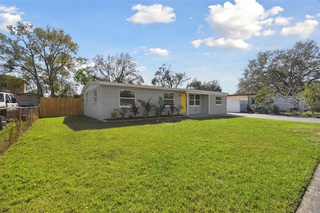 ranch-style house featuring a front lawn