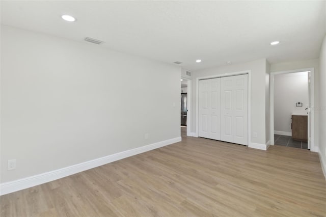 unfurnished room featuring light hardwood / wood-style flooring