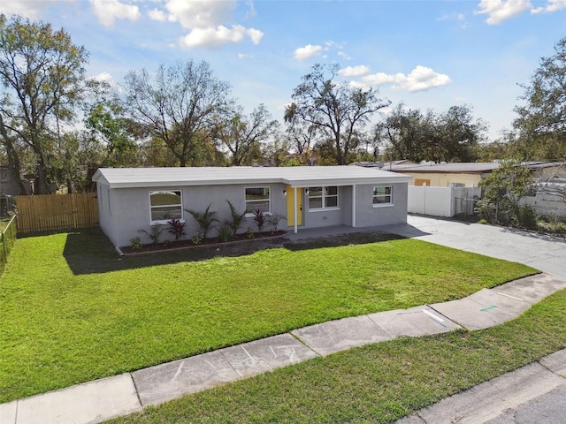 ranch-style house with a front lawn