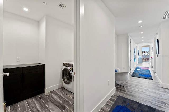 5120 Marina Way Unit 14002, Tampa, FL 33611 - clothes washing area featuring washer / dryer, wood tiled floor, laundry area, and baseboards
