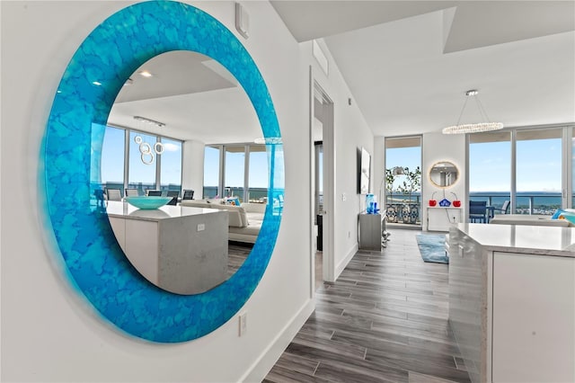 5120 Marina Way Unit 14002, Tampa, FL 33611 - interior space with expansive windows, plenty of natural light, baseboards, and wood tiled floor