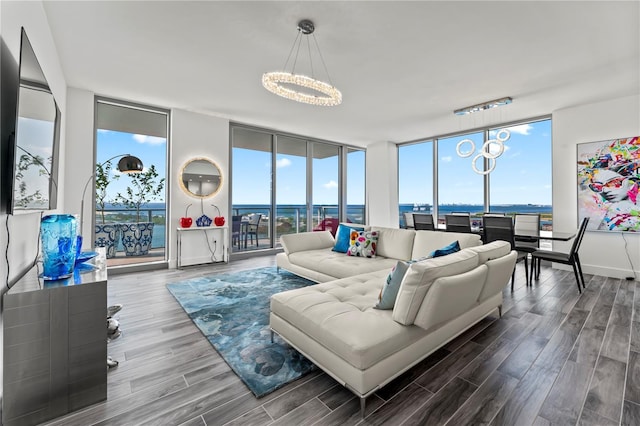 5120 Marina Way Unit 14002, Tampa, FL 33611 - living area with a healthy amount of sunlight, an inviting chandelier, a wall of windows, and wood finish floors