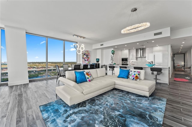 5120 Marina Way Unit 14002, Tampa, FL 33611 - living area featuring floor to ceiling windows, recessed lighting, visible vents, wood finished floors, and baseboards