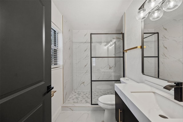 full bathroom with vanity, toilet, marble finish floor, and a marble finish shower