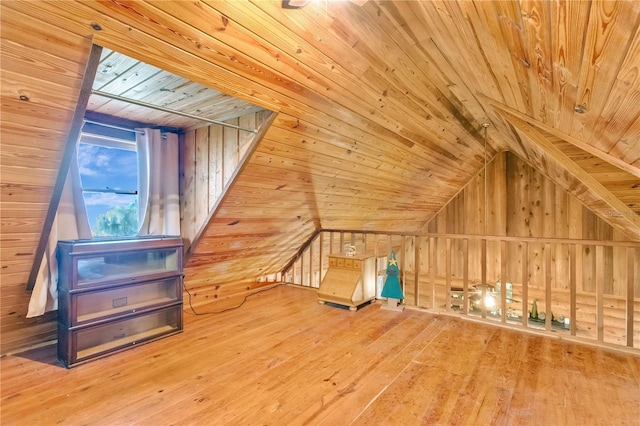 bonus room featuring wood ceiling, lofted ceiling, hardwood / wood-style floors, and wood walls