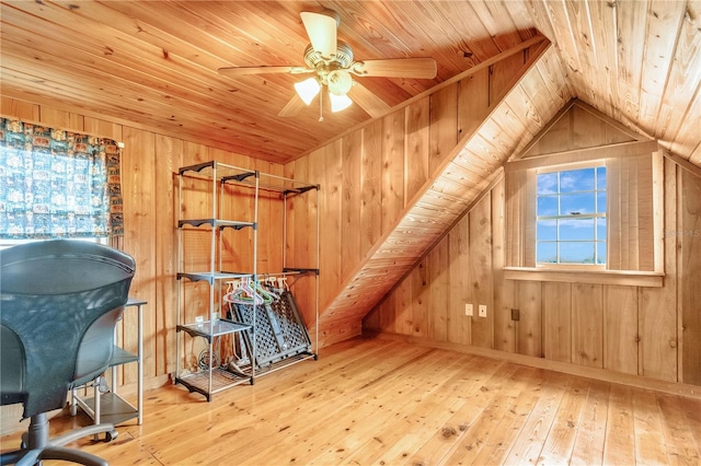 additional living space featuring hardwood / wood-style floors, wood ceiling, wooden walls, and vaulted ceiling