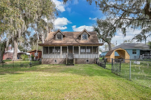 view of front facade featuring a front lawn and a sunroom