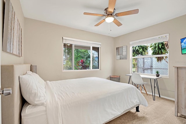 bedroom with light colored carpet and ceiling fan