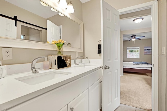 bathroom with ceiling fan and vanity