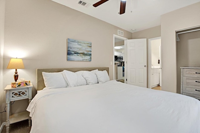 bedroom with ensuite bath and ceiling fan