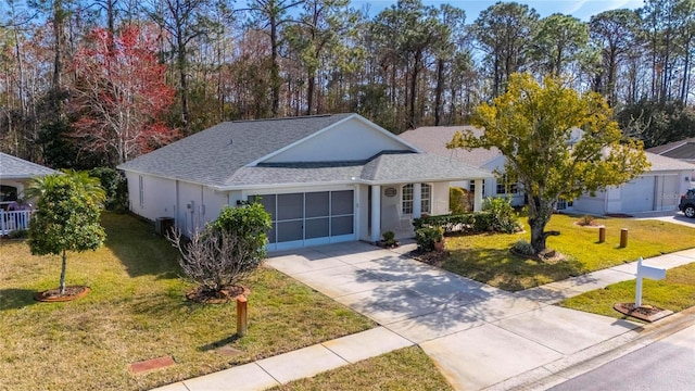 ranch-style house with a garage and a front lawn