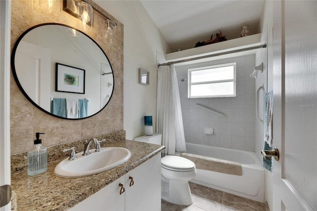 full bathroom with shower / tub combo with curtain, backsplash, vanity, tile patterned floors, and toilet