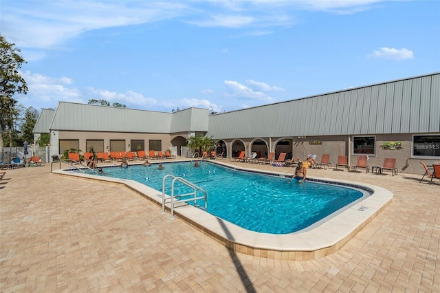 view of swimming pool with a patio