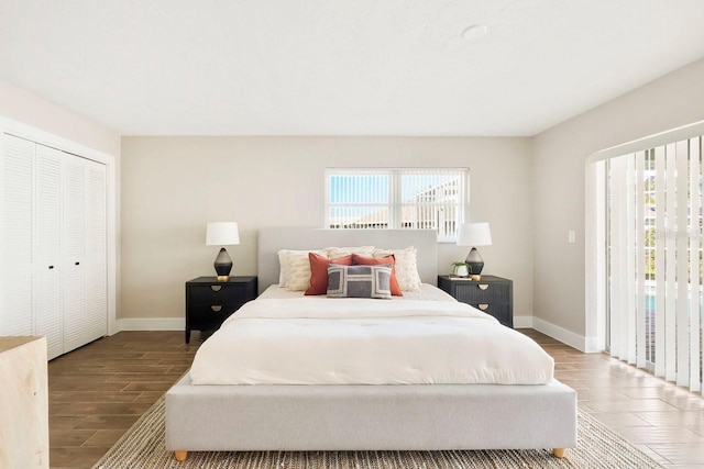 bedroom featuring hardwood / wood-style floors and a closet