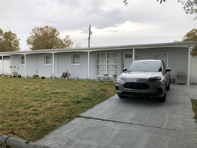 single story home featuring a front yard