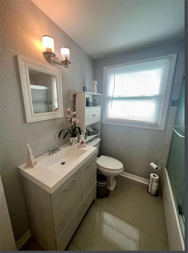 full bathroom with vanity, bathtub / shower combination, and toilet