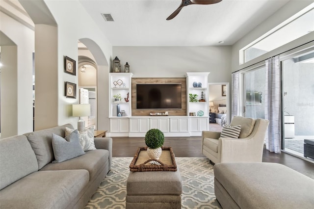 living room featuring hardwood / wood-style flooring and ceiling fan