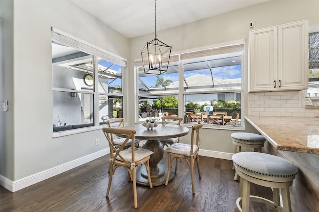 dining area with dark hardwood / wood-style flooring