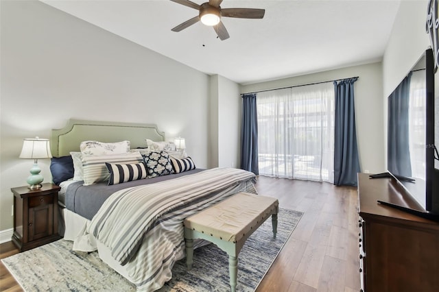 bedroom featuring wood-type flooring and ceiling fan