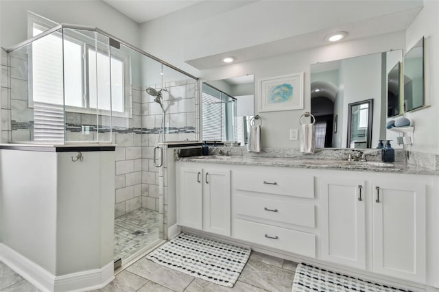 bathroom with vanity and walk in shower