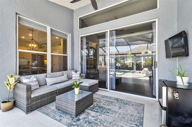 exterior space featuring ceiling fan with notable chandelier