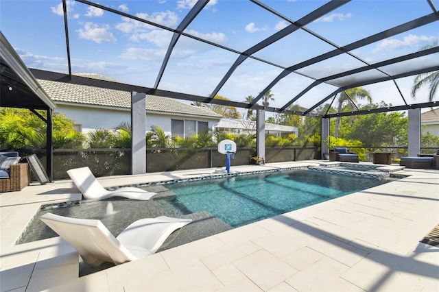 view of pool featuring a patio area and glass enclosure