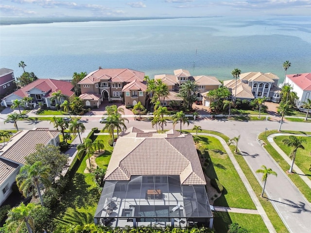 birds eye view of property with a water view