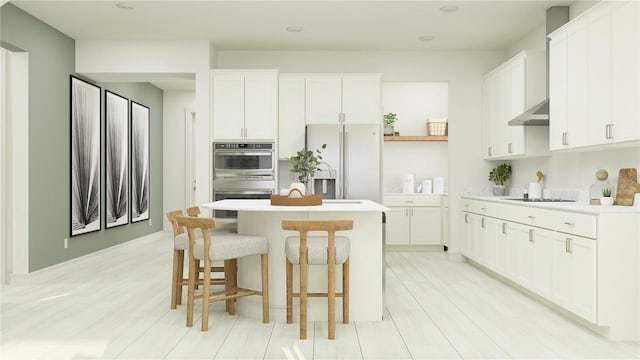 kitchen with refrigerator with ice dispenser, a kitchen island with sink, ventilation hood, white cabinets, and stainless steel double oven