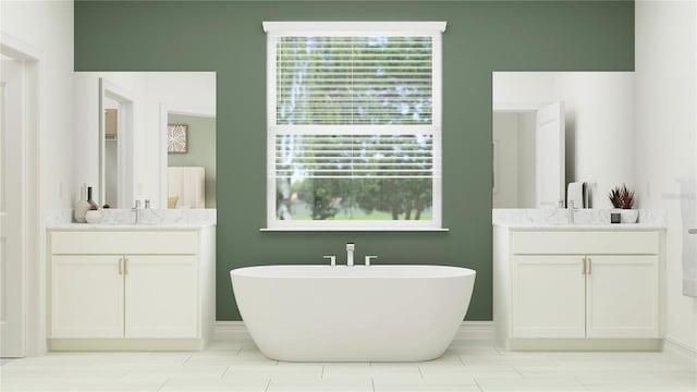 bathroom featuring vanity and a washtub