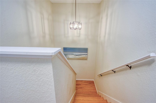 stairs featuring hardwood / wood-style floors