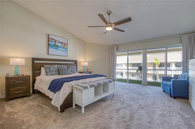 carpeted bedroom with ceiling fan, lofted ceiling, access to exterior, and a textured ceiling