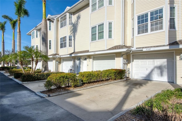 exterior space featuring driveway and an attached garage