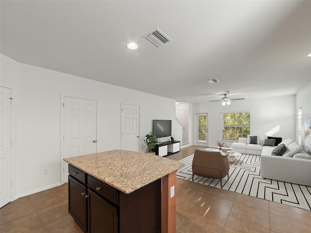 4734 Chatterton Way, Riverview, FL 33578 - kitchen with dark tile patterned flooring, light countertops, open floor plan, ceiling fan, and recessed lighting