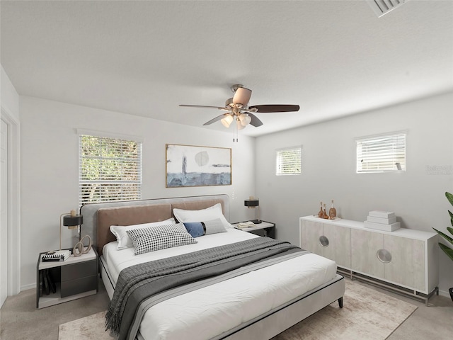 4734 Chatterton Way, Riverview, FL 33578 - bedroom featuring light colored carpet, multiple windows, and a ceiling fan