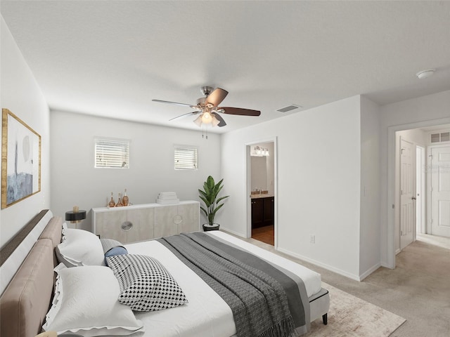 4734 Chatterton Way, Riverview, FL 33578 - bedroom featuring light colored carpet, ceiling fan, connected bathroom, and baseboards