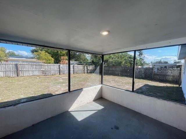 unfurnished sunroom featuring plenty of natural light