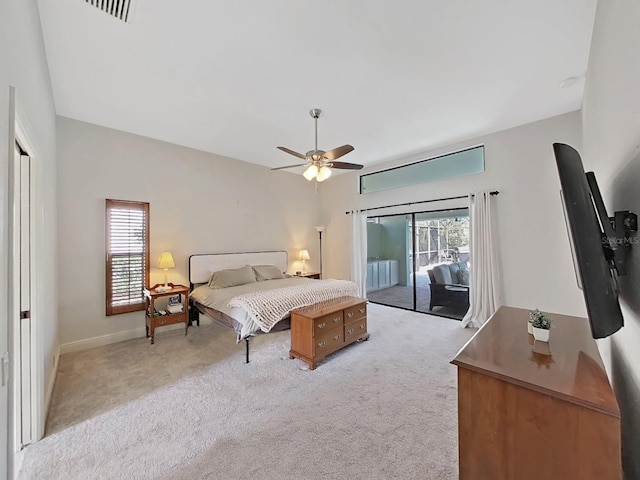 carpeted bedroom featuring multiple windows, access to outside, and ceiling fan