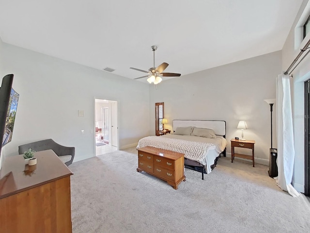 carpeted bedroom with vaulted ceiling and ceiling fan