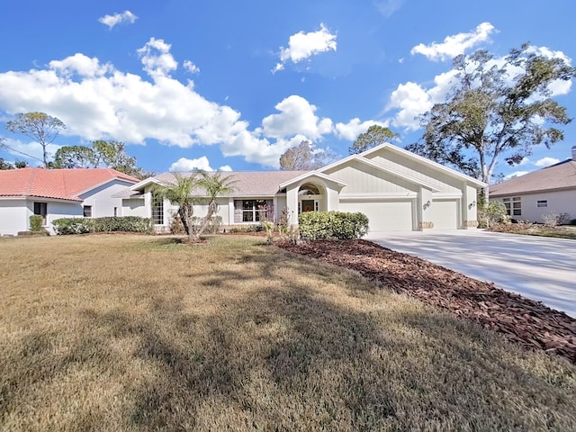 single story home featuring a garage and a front yard