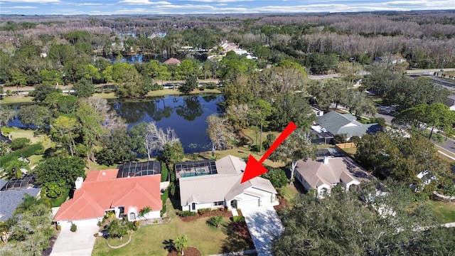 birds eye view of property with a water view