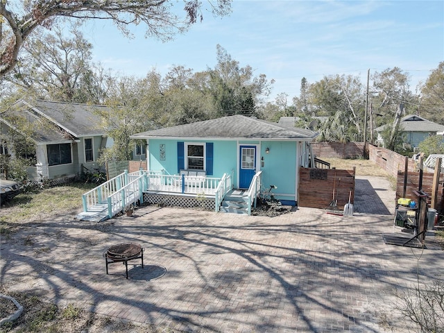 view of front of property with an outdoor fire pit