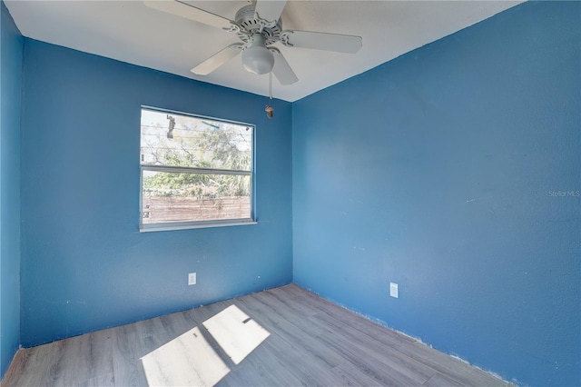 unfurnished room featuring ceiling fan and light wood-type flooring