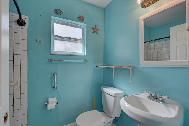 bathroom featuring sink and toilet