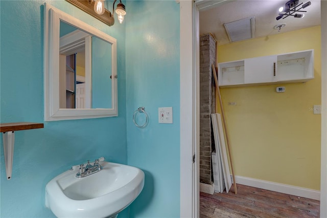 bathroom featuring sink and hardwood / wood-style floors