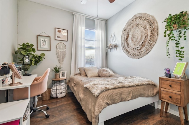 bedroom with ceiling fan and dark hardwood / wood-style flooring